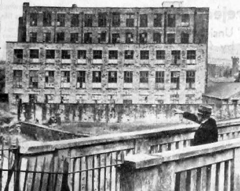 Alderman Sellers pointing to Shepley Mill from the George Street footbridge