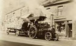 Tiger tractor passing Bowden's Cafe, 1905